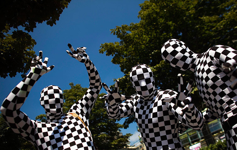 24 hours : Revellers dressed in costumes dance in the streets in Zurich