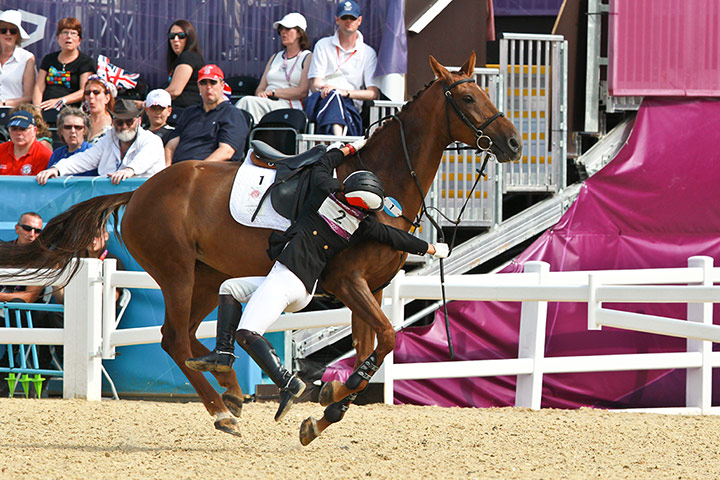 Modern Pentathlon Oly: Narumi Kurosi of Japan falls of her horse during the Modern Pentathlon.