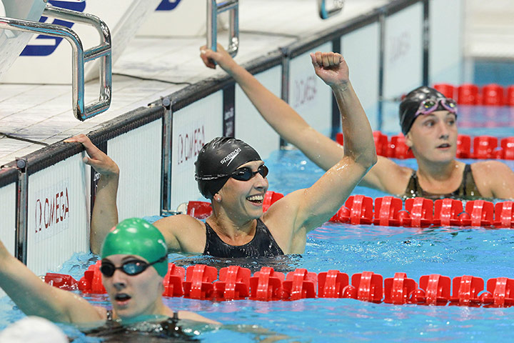 Modern Pentathlon Oly: Katarzyna of Poland swimming and celebrating her victory in the second heat
