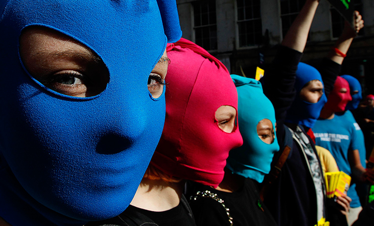 24 hours in pictures: Masked protesters in an Amnesty flashmob in Edinburgh in support of Pussy Riot
