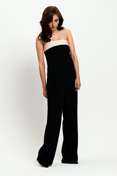 All Ages: Monochrome: Model wears black jumpsuit with white band along the top