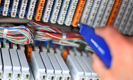 A BT engineer connects customers to a high-speed fibre-optic network