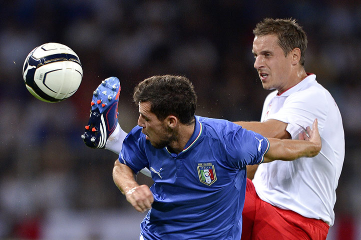 Italy gallery: England's defender Phil Jagielka (R) vie