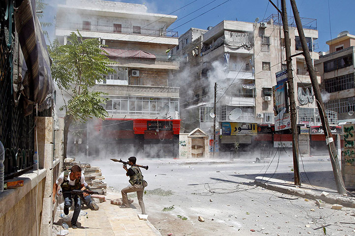 Syrian Conflict: A Free Syrian Army fighter prepares to fire an RPG 