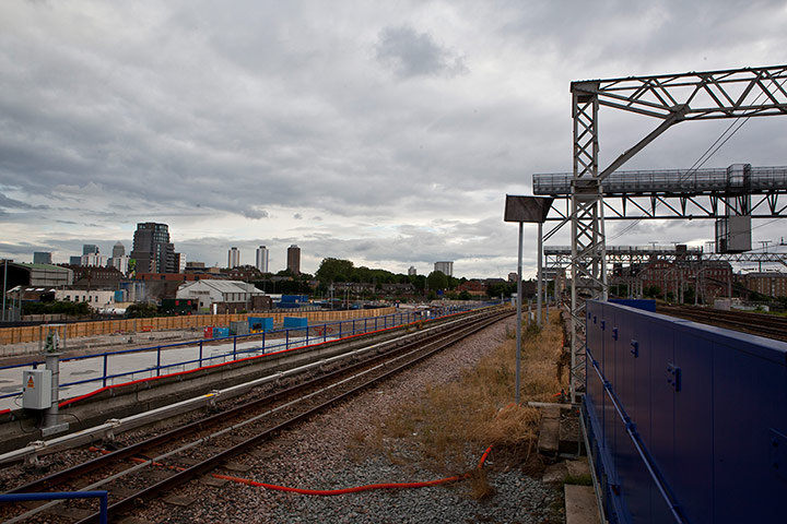 London Legacy: Photo of railway line with Canary Wharf in distance