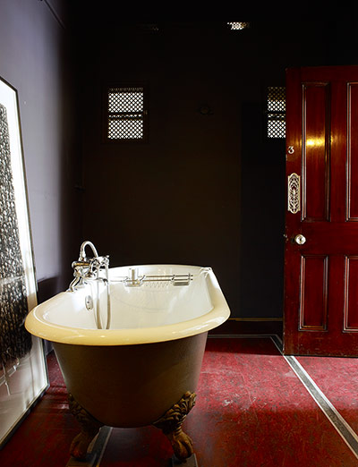 Homes: Bathroom: Roll top bath with plum coloured walls