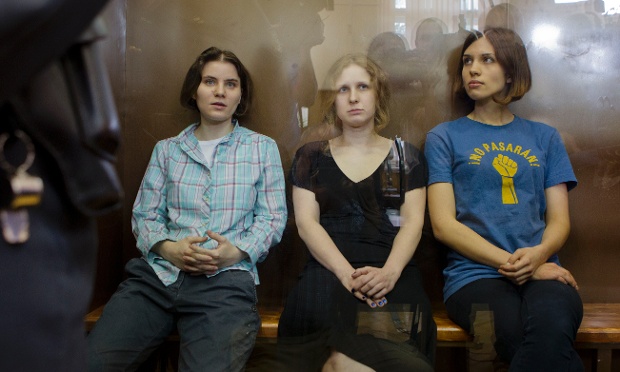 Here are the feminist punk group Pussy Riot members, Nadezhda Tolokonnikova, right, Maria Alekhina, center, and Yekaterina Samutsevich, sitting in a glass cage in the court room in Moscow, awaiting the verdict.