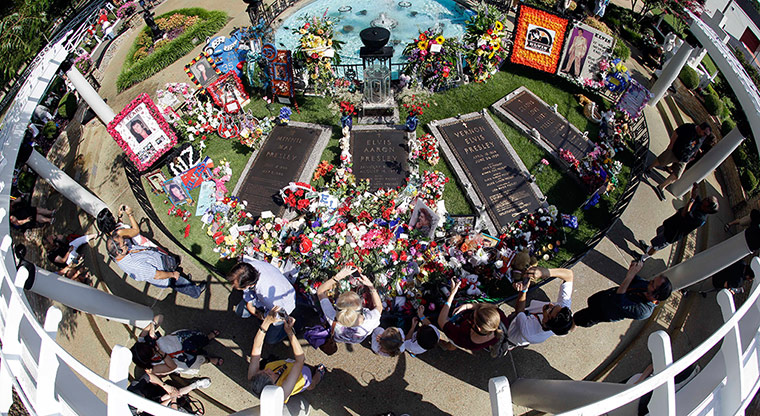 24 hours in pictures: Elvis Presley fans visit his grave at Graceland