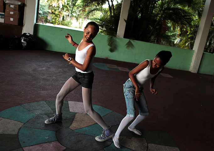 From the agencies: Girls joke with each other during practice
