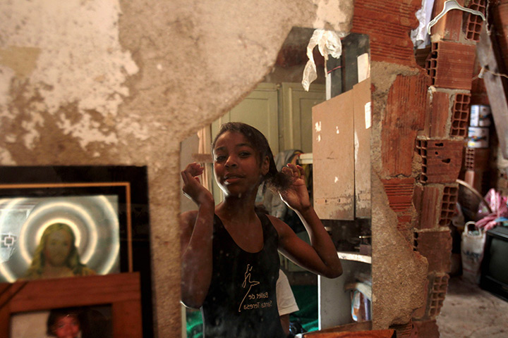 From the agencies: Marie Ellen da Silva fixes her hair