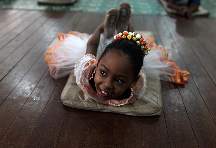 From the agencies: A girl stretches on the floor