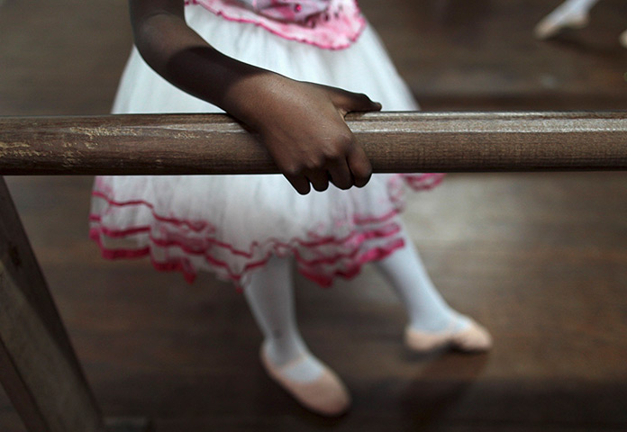 From the agencies: A girl warms up on the barre