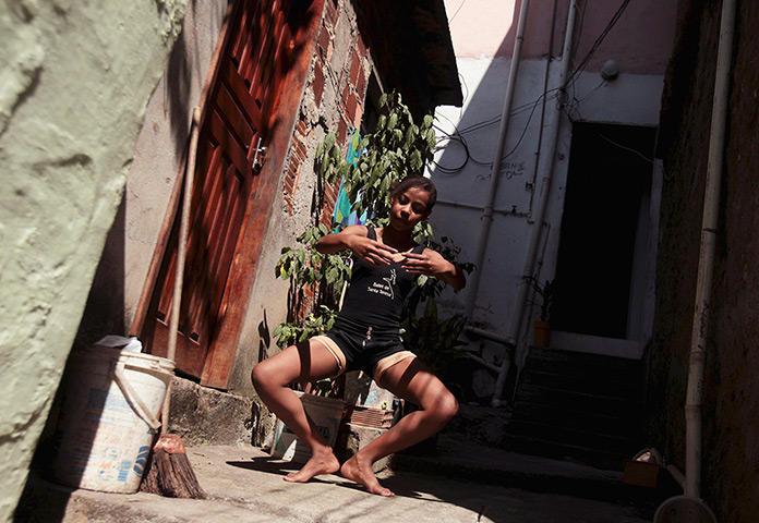 From the agencies: Marie Ellen da Silva practices ballet outside her home