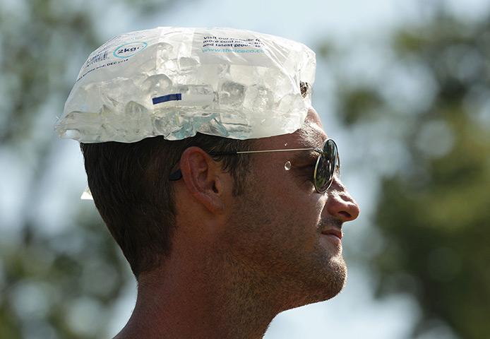 V Festival day 1: A man cools down with an ice-pack at the V Festival in Hylands Park