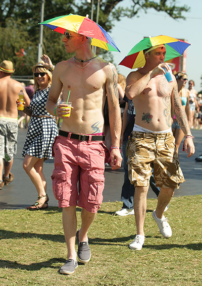 V Festival day 1: Festival goers wearing umbrella hats at the V Festival in Hylands Park
