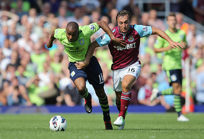 prem gallery: Fabian Delph and Mark Noble battle for the ball 