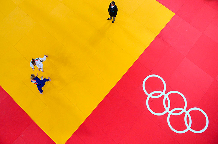 Robotic camera: France's Automne Pavia, in white, competes with Hungary's Hedvig Karakas