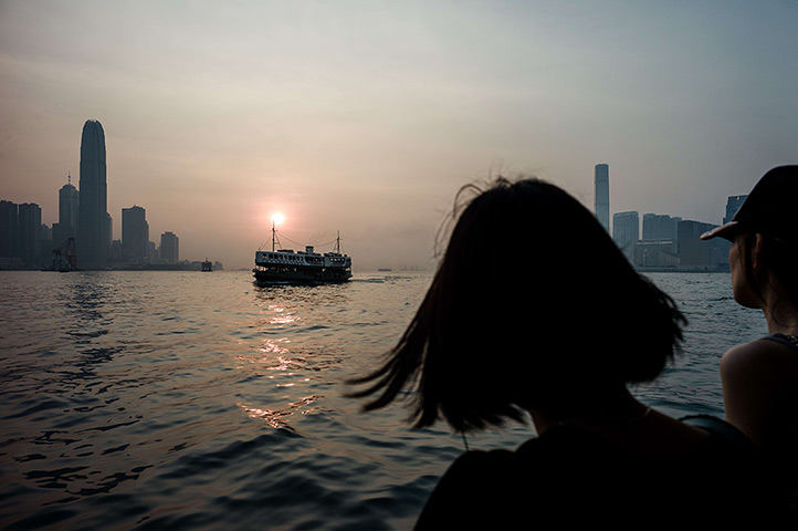 24 hours: Hong Kong, China: A woman looks at the city's skyline