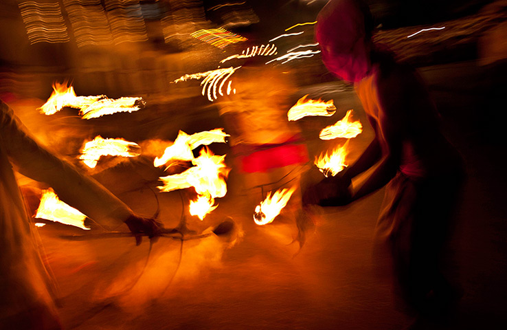 24 hours: Kandy, Sri Lanka: Traditional dancers perform with fire 