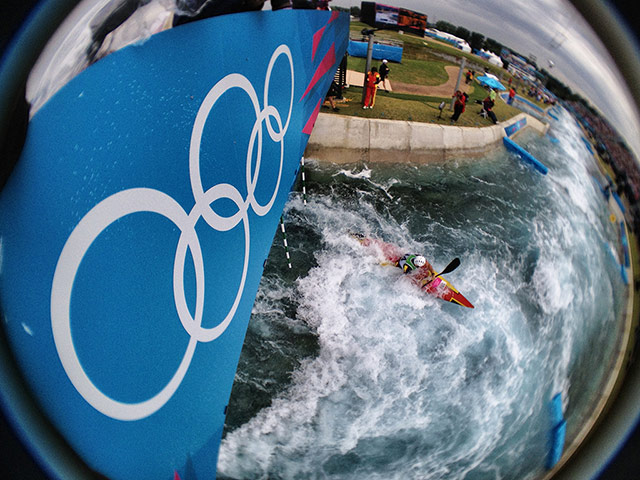 Dan Chung Gallery: Spain's Samuel Hernanz paddles under the Olympic rings