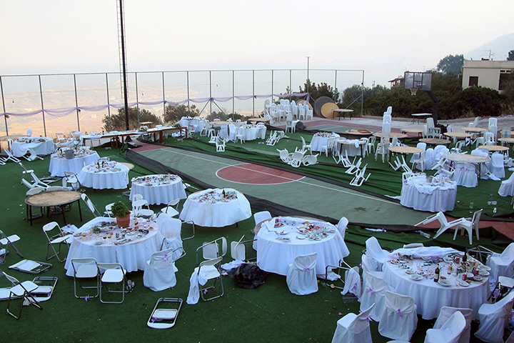 24 hours: Lithi, Chios island, Greece: Chairs and tables at an open wedding feast