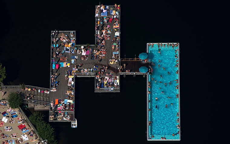 24 hours: Berlin, Germany: People gather on landing stages on the river Spree 