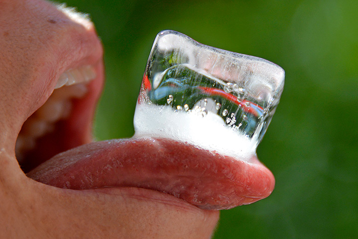 24 hours: Herten, Germany: A woman with an ice cube on her tongue 