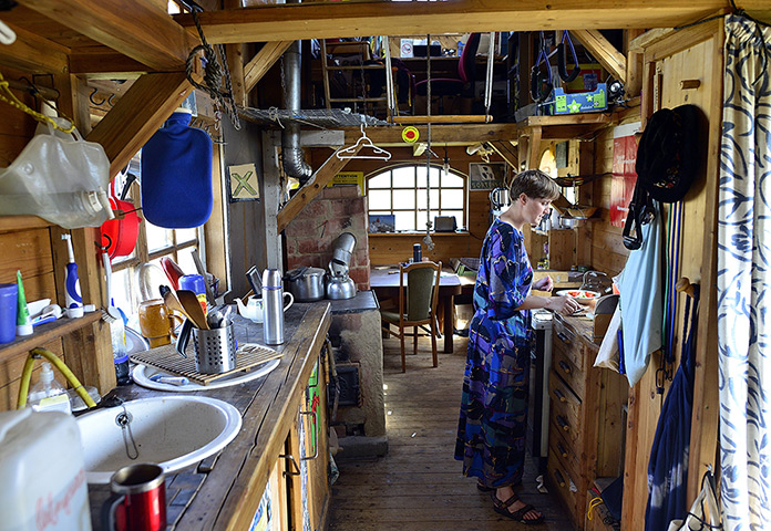 Wagenburg settlement: French environment activist Cecile Lecomte prepares her lunch
