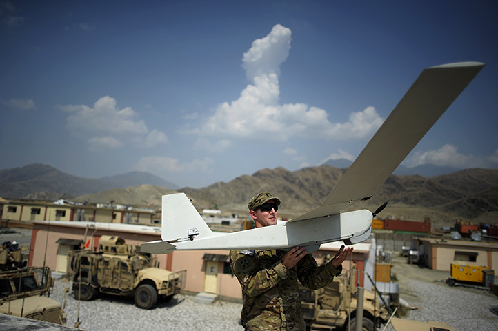 24 hours in pictures: Lieutenant David Mc Curdy prepares to launch a Puma Dorin airplane