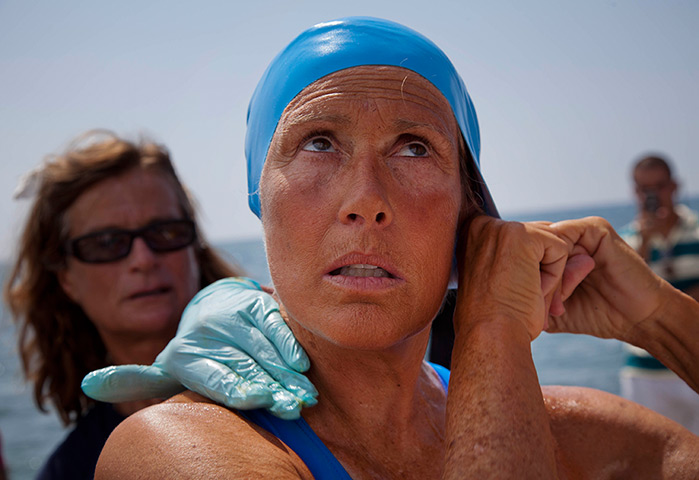 Diana Nyad: Diana Nyad adjusts her swimming cap before her swim