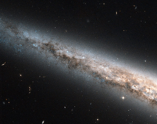 A month in space: Hubble Sees the Needle Galaxy, Edge-on and Up Close