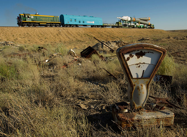 A month in space: The Soyuz TMA-05M spacecraft is rolled out by train