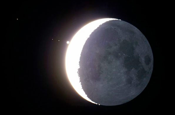 A month in space: the crescent moon nearly eclipses Jupiter—with Venus