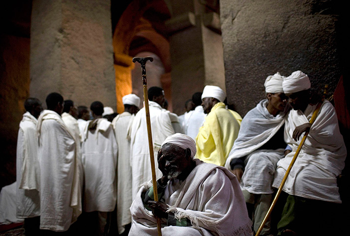 24 hours: Lalibela, Ethiopia: Orthodox Christian pilgrims pray at Bet Medhane Alem