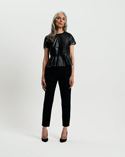 All Ages Fashion: Leather: Woman in black leather top and black trousers