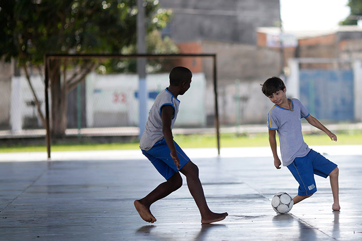 24 hours in pictures: Gabriel Muniz, 11, plays soccer with schoolmates in Campos dos Goytacazes
