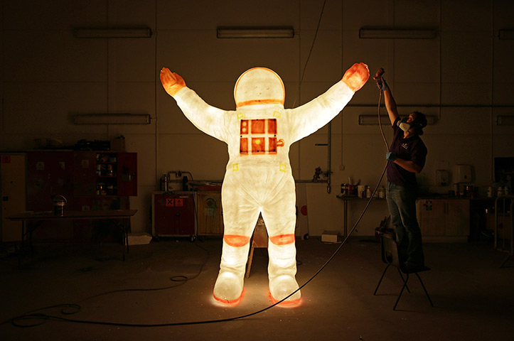 24 hours in pictures: An employee of 'Lightworks' makes some finishing touches, Blackpool