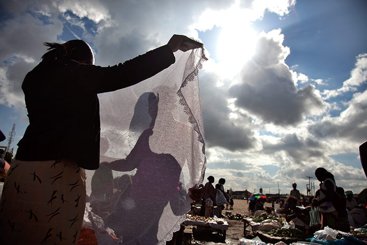 Adolphus: Used clothing market in Shawarma slum, Zambia