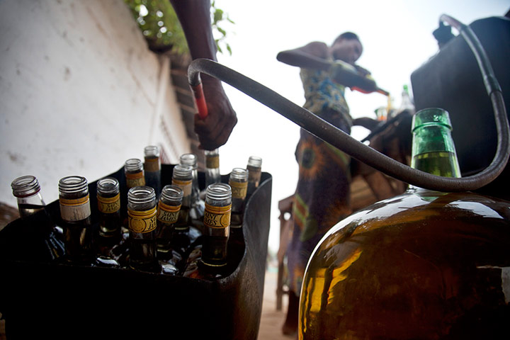 Adolphus: Selling fuel in bottles in Ouidah, Benin Republic