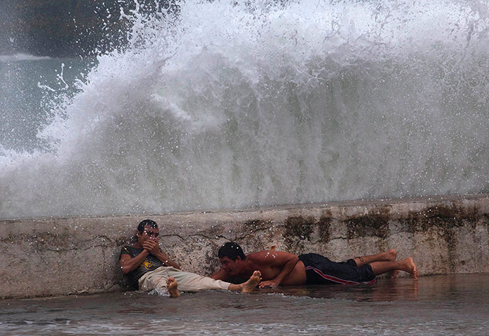 Tropical Storm Isaac: Waves crash over a seawall in Baracoa, Cuba