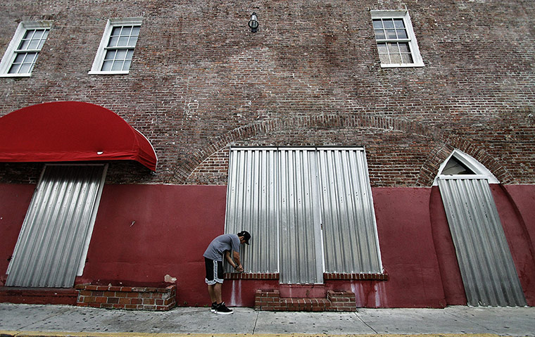 Tropical Storm Isaac: Arthur Asti installs storm shutters in Key West, Florida