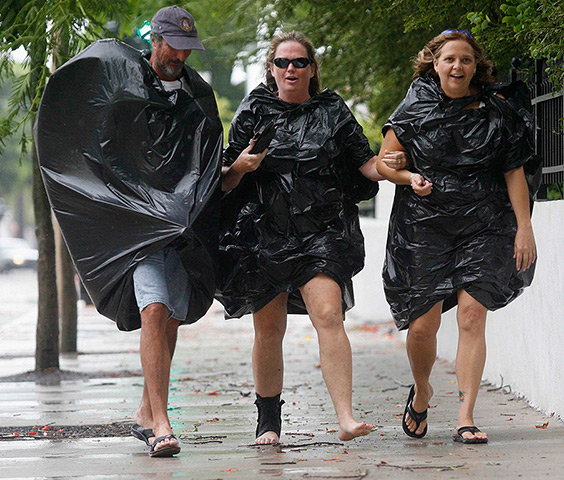 Tropical Storm Isaac: People wearing bin liners to protect themselves against the rain, Key West