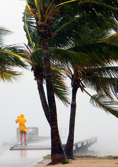 Tropical Storm Isaac: A person braves the rain at Clarence Higgs Beach in Key West