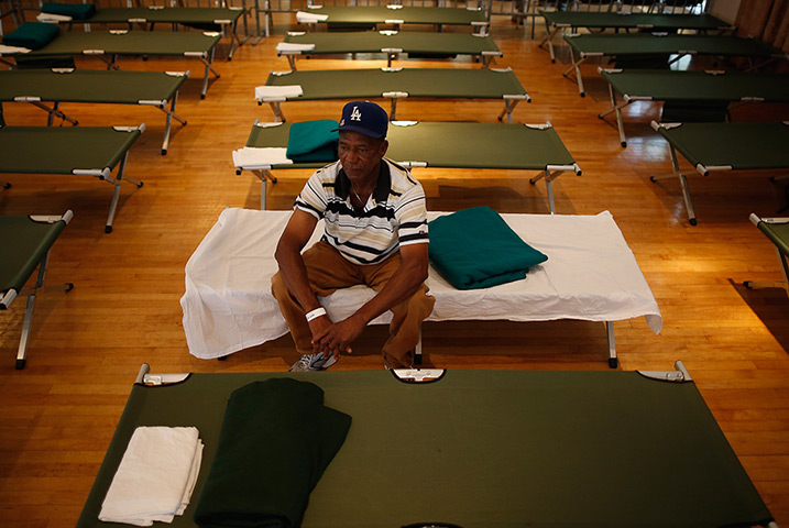 Tropical storm Isaac: Man rests in the hurricane shelter at the Belle Chasse Auditorium