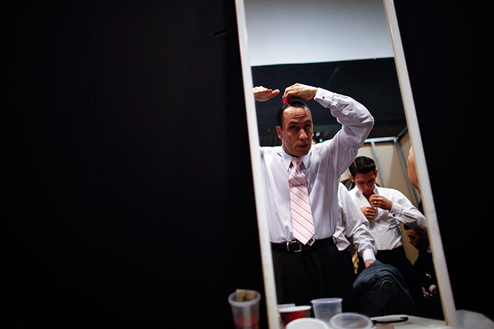 World tango championships: Argentina's dancer Cristian Lopez combs his hair before competing