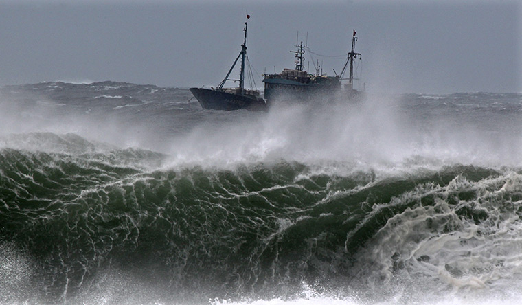 24 hours: Jeju Island, South Korea: A Chinese fishing boat navigates in rough waves 