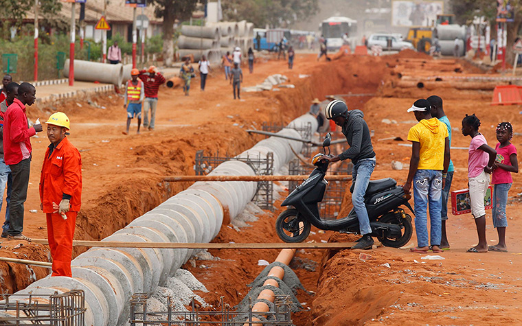 24 hours: Viana, Angola: a motorcyclist tries to cross a construction site 