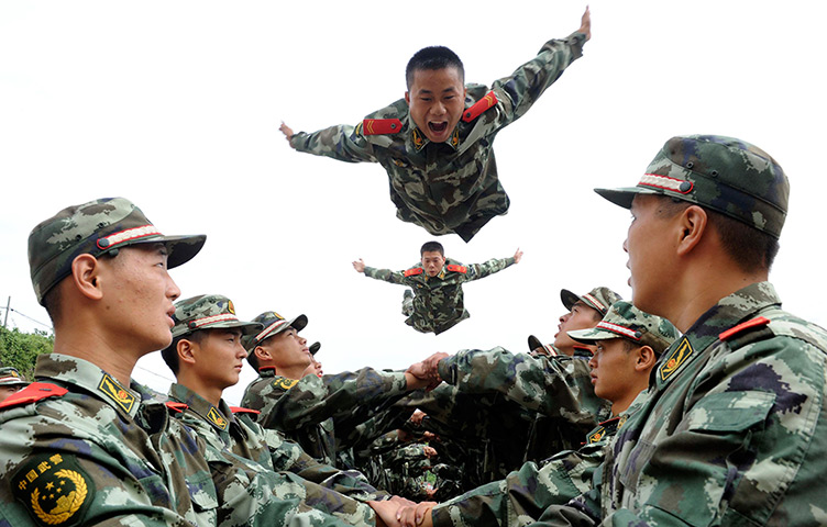 24 hours: Tongling, China: Paramilitary policemen jump during psychological training