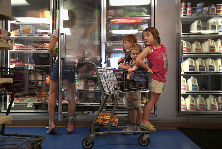Tropical storm Isaac: Family shops for frozen items at Seal's Marketplace in Kiln, Mississippi