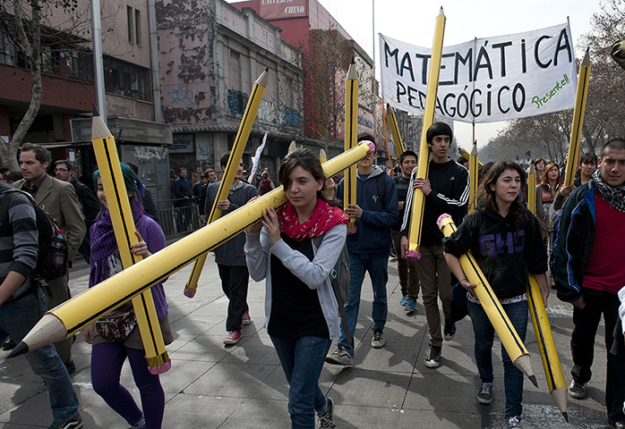 24 hours: Santiago, Chile: Students march with giant pencils 